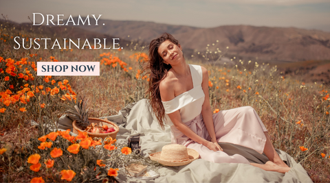 Lady Sitting in the flowery garden wearing Malina Asymmetrical One Shoulder Tencel Top