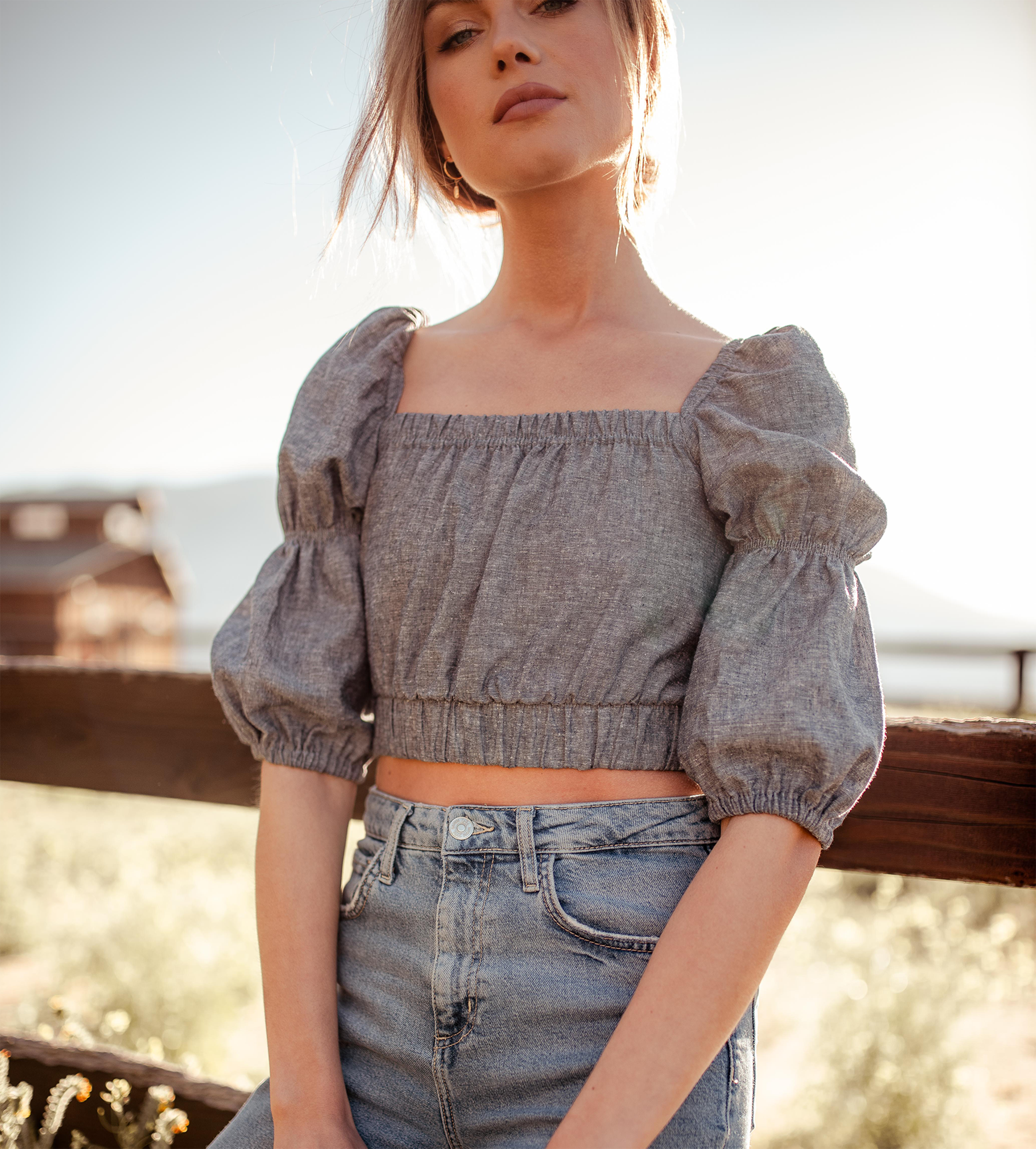 woman wearing double puff sleeve top made of sustainable hemp fabric